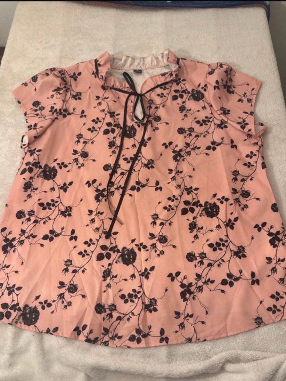Women’s pink blouse with black flowers